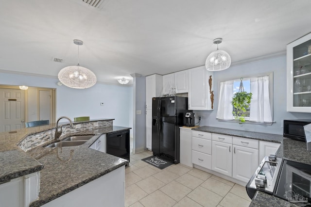 kitchen with white cabinetry, sink, decorative light fixtures, and black appliances