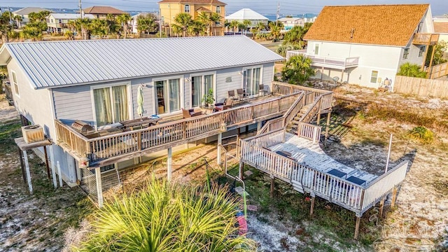 back of property with a wooden deck