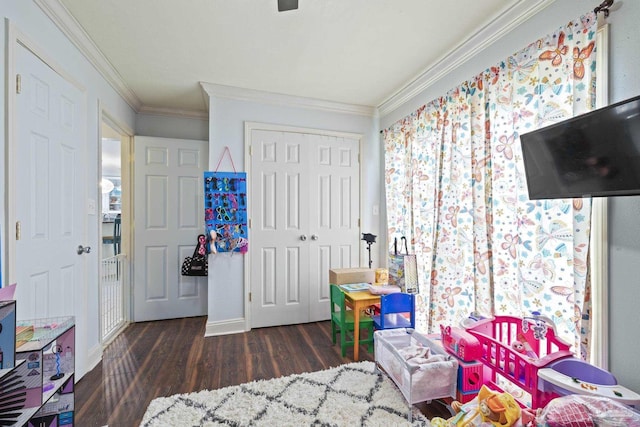 bedroom featuring ornamental molding, dark wood-type flooring, and a closet