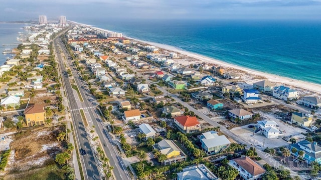 birds eye view of property featuring a water view and a view of the beach