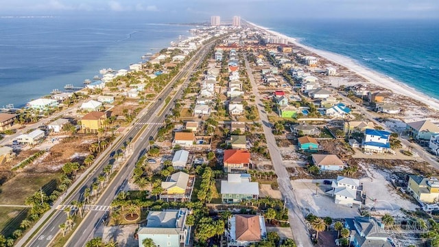 birds eye view of property featuring a water view and a view of the beach