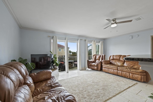 living room with ornamental molding, light tile patterned floors, and ceiling fan