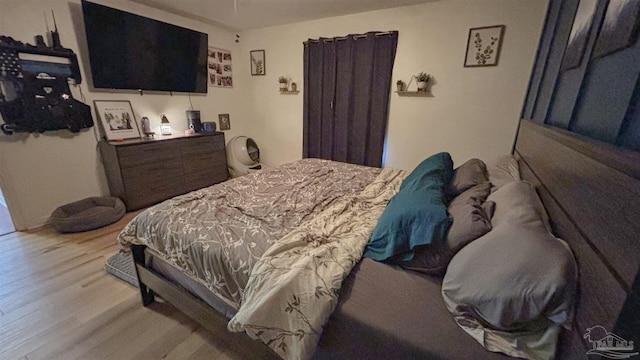 bedroom with light hardwood / wood-style floors