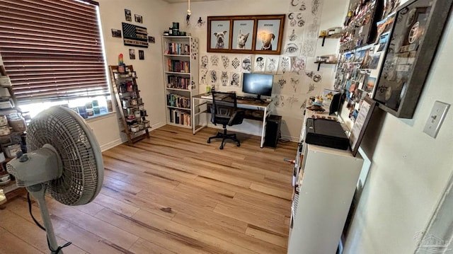 home office with light wood-type flooring