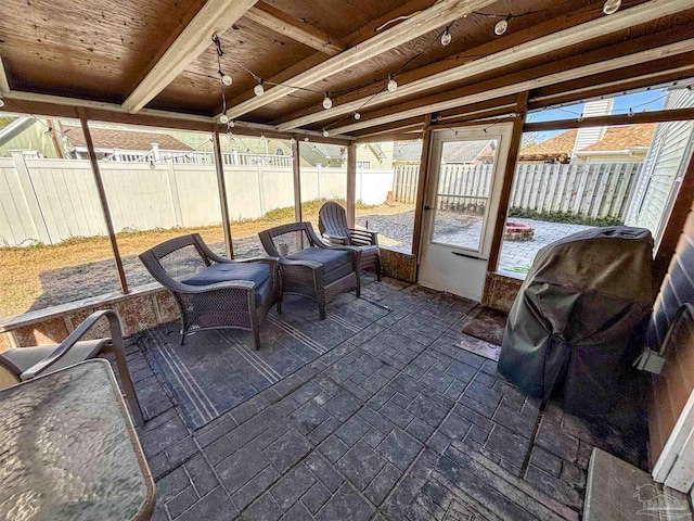 sunroom featuring wooden ceiling