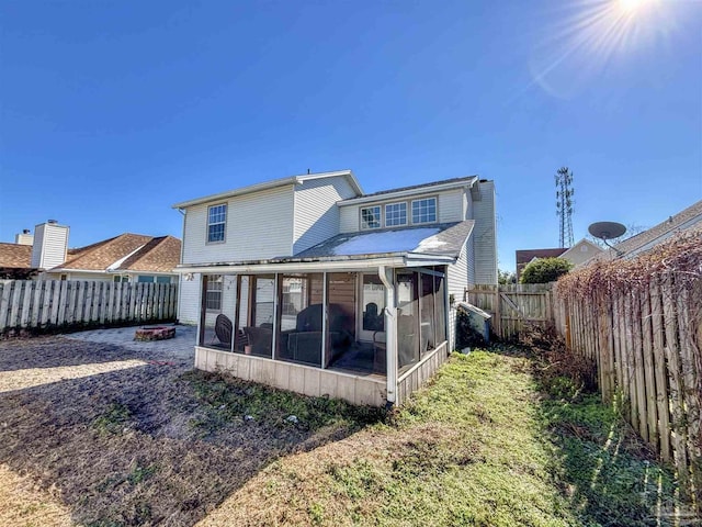 back of property featuring a sunroom