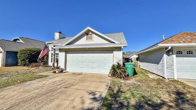 view of side of home with a garage and a lawn