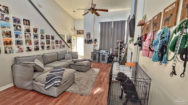 living room with hardwood / wood-style floors and ceiling fan