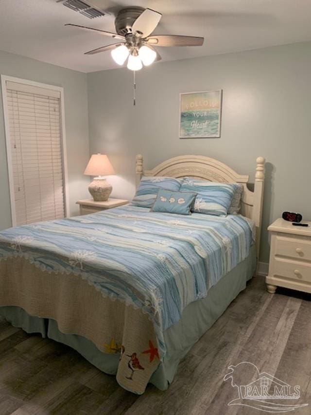 bedroom featuring ceiling fan and hardwood / wood-style floors