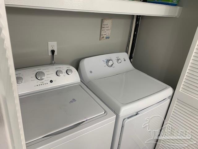 laundry area with washing machine and dryer