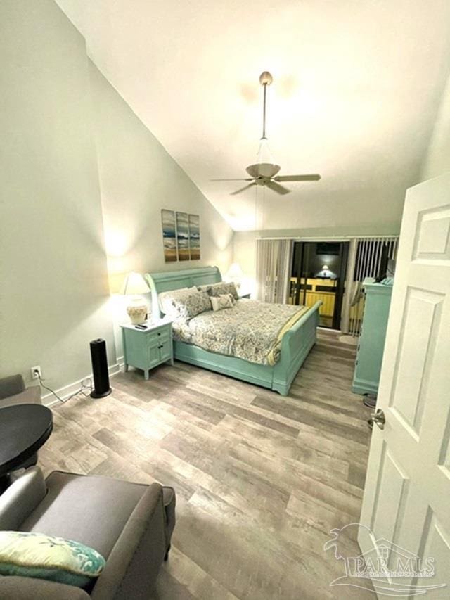 bedroom with ceiling fan, high vaulted ceiling, and light hardwood / wood-style floors