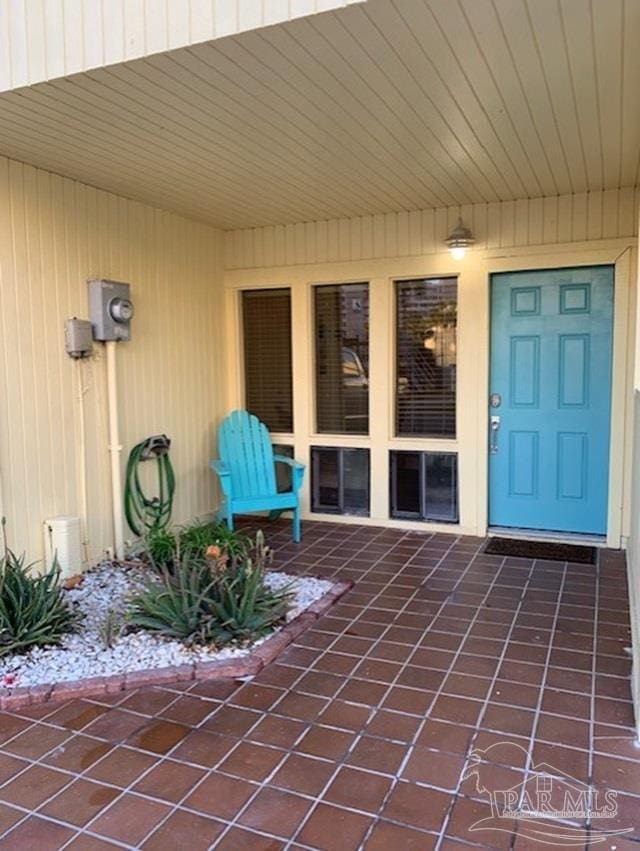 doorway to property with a patio