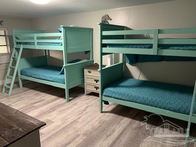 bedroom featuring hardwood / wood-style floors