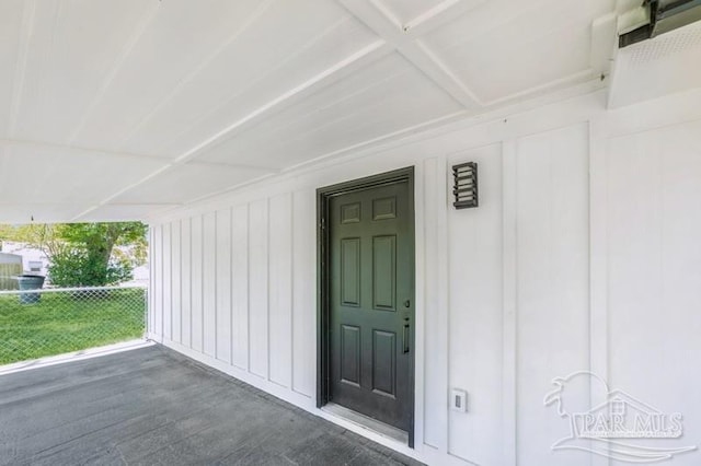doorway to property with board and batten siding