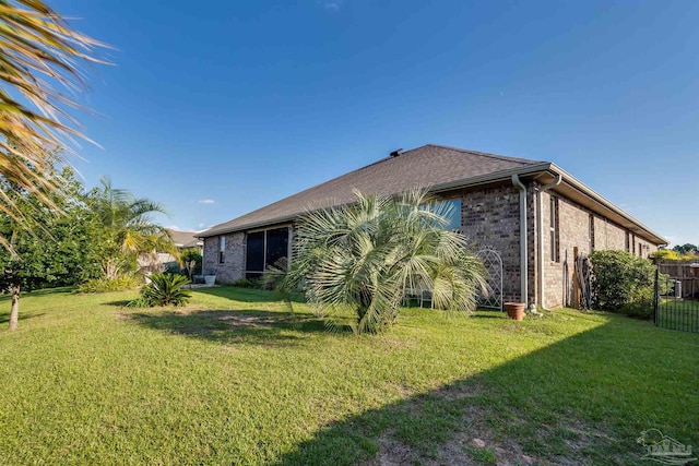 back of house featuring a yard