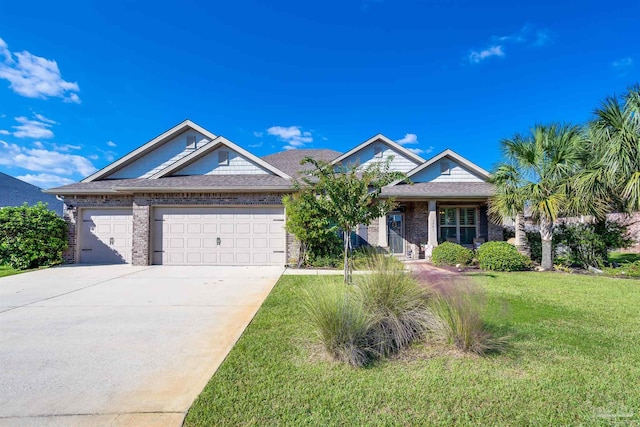 view of front of property featuring a front lawn and a garage