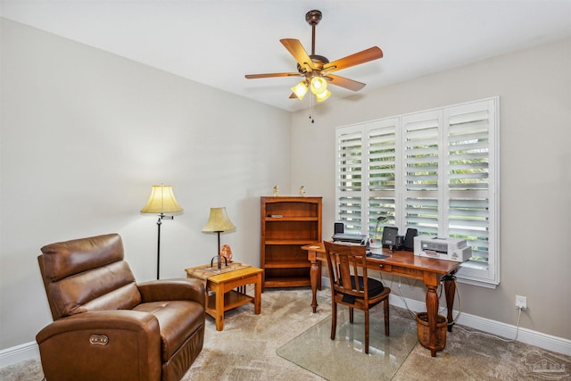 carpeted office with ceiling fan