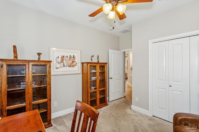 office area with light carpet and ceiling fan