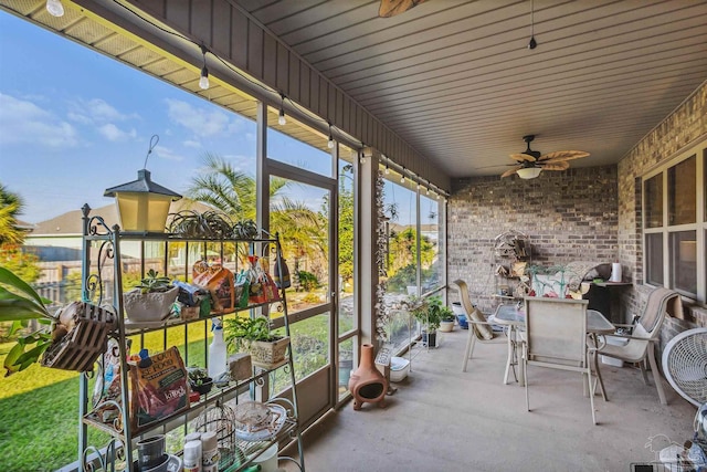 exterior space featuring ceiling fan