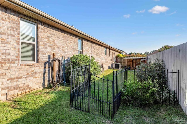 view of yard with central AC