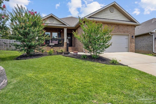 6372 Ladera Trl, Pace, FL 32571 - view of front of home with brick siding, concrete driveway, covered porch, and a garage