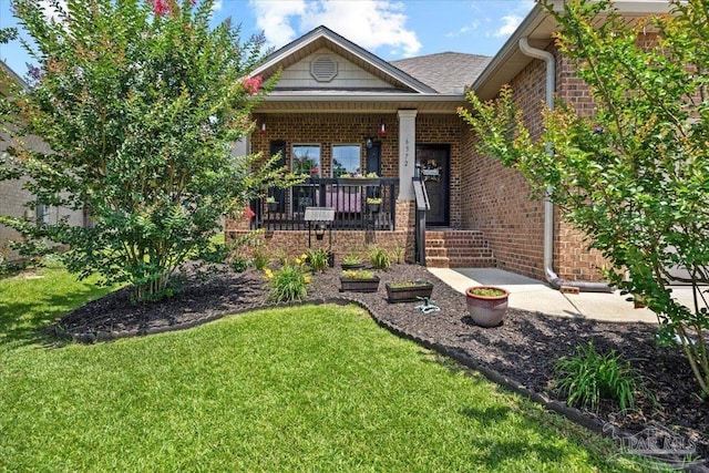 6372 Ladera Trl, Pace, FL 32571 - view of front of home with brick siding, a front yard, and covered porch