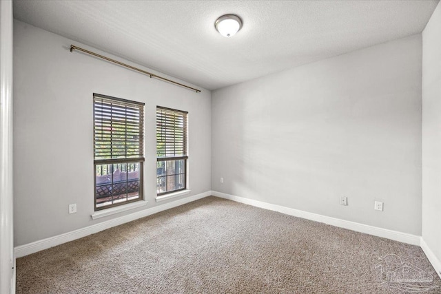 6372 Ladera Trl, Pace, FL 32571 - carpeted spare room featuring baseboards and a textured ceiling