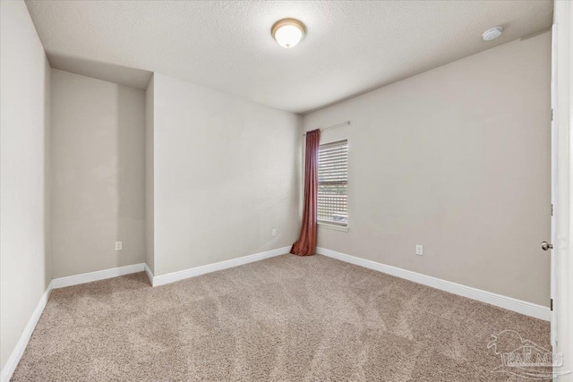 6372 Ladera Trl, Pace, FL 32571 - carpeted empty room featuring a smoke detector, baseboards, and a textured ceiling