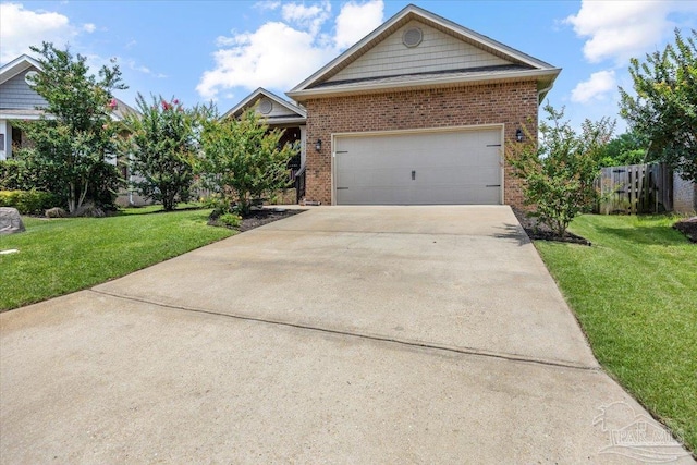6372 Ladera Trl, Pace, FL 32571 - view of front of house featuring brick siding, driveway, and a garage