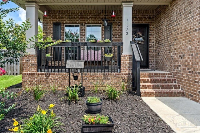 6372 Ladera Trl, Pace, FL 32571 - view of exterior entry with brick siding and covered porch