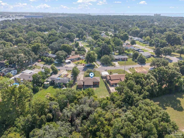 birds eye view of property with a residential view and a wooded view