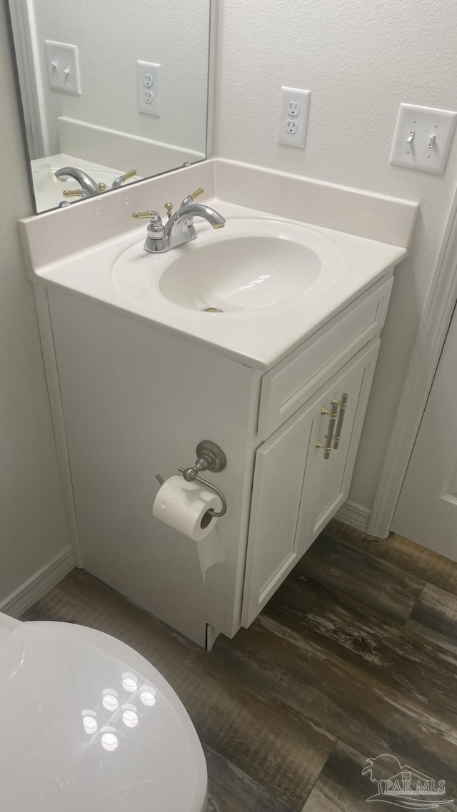 bathroom featuring vanity and wood finished floors