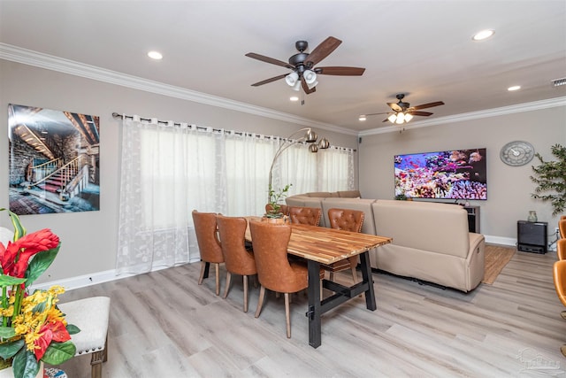 dining room with light hardwood / wood-style floors, ceiling fan, and ornamental molding