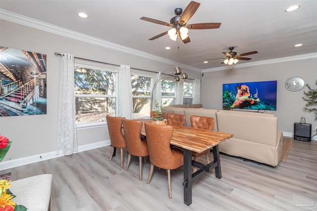 dining room featuring ceiling fan, light hardwood / wood-style floors, and crown molding