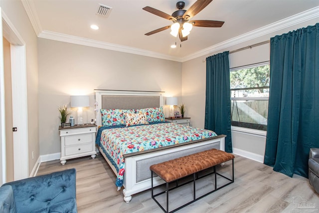 bedroom featuring ceiling fan, crown molding, and light hardwood / wood-style floors