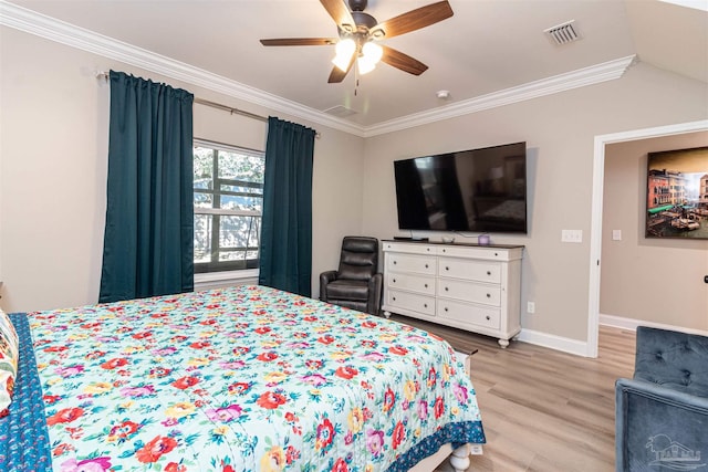 bedroom with ceiling fan, light hardwood / wood-style flooring, and crown molding