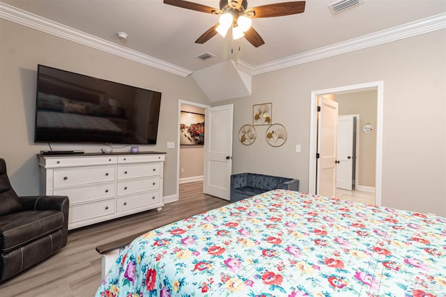 bedroom with ceiling fan, ornamental molding, and wood-type flooring