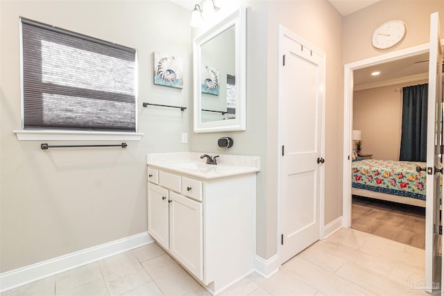 bathroom with tile patterned flooring and vanity