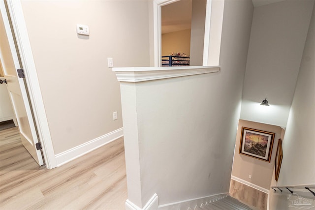 stairs featuring hardwood / wood-style floors