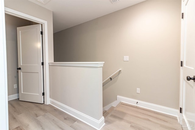 stairs featuring wood-type flooring