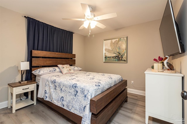 bedroom featuring hardwood / wood-style flooring and ceiling fan