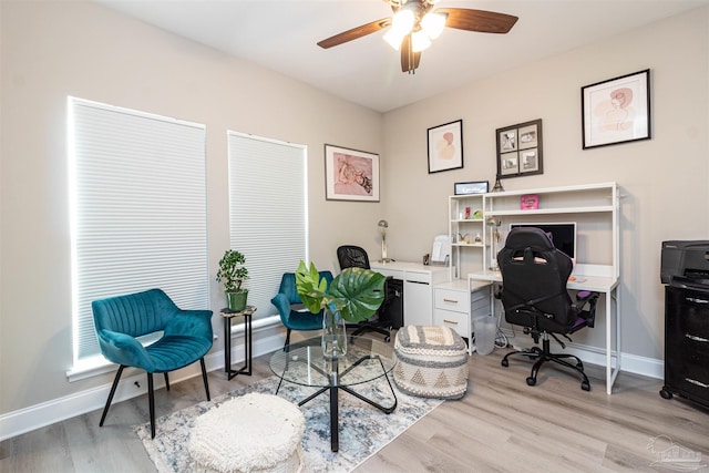 office space featuring ceiling fan and light hardwood / wood-style floors