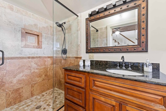 full bathroom featuring a shower stall and vanity