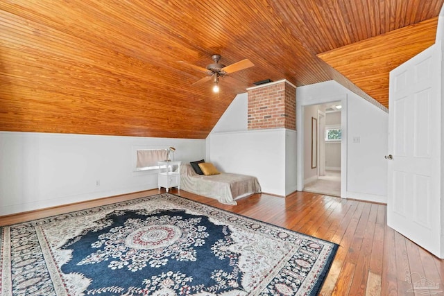 bedroom featuring wooden ceiling, a ceiling fan, hardwood / wood-style flooring, baseboards, and lofted ceiling