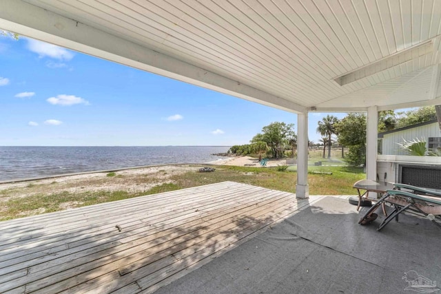 exterior space featuring a beach view and a water view