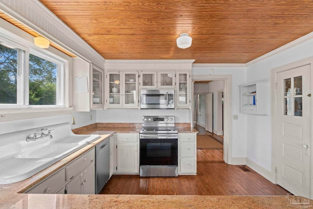kitchen with crown molding, white cabinetry, stainless steel appliances, and wood ceiling