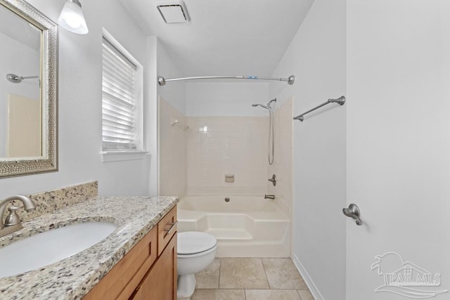 full bathroom featuring vanity, tile patterned floors, tiled shower / bath combo, and toilet