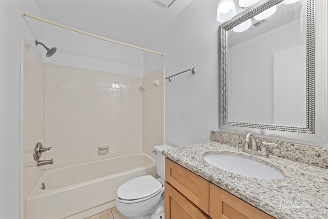 full bathroom featuring tile patterned floors, vanity, toilet, and tiled shower / bath