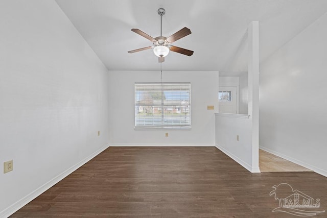 spare room featuring ceiling fan and dark hardwood / wood-style floors