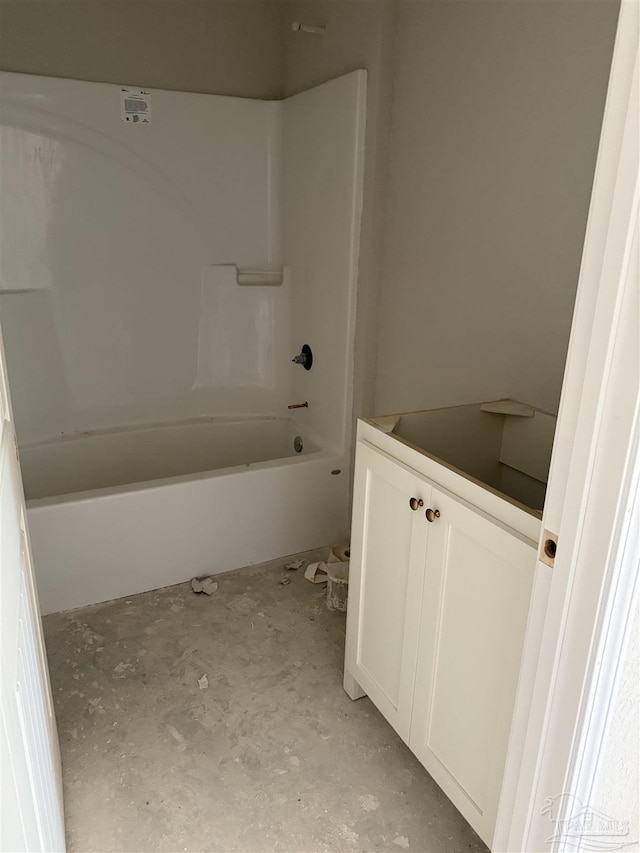full bathroom with unfinished concrete floors and shower / washtub combination